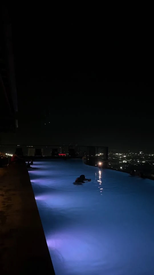 A rooftop infinity pool overlooking Cebu city lights, from Nicole's travel video